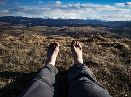 abstract bare feet with landscape in backgroundの写真素材
