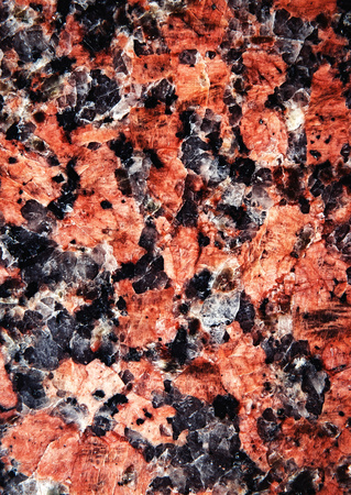abstract background or texture red and black mottled stoneの写真素材
