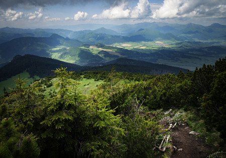 landscape View from the mountains to the sunny valleyの写真素材
