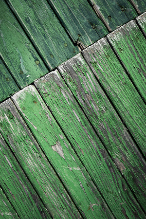 background or texture oblique turned old green wooden panelingの写真素材