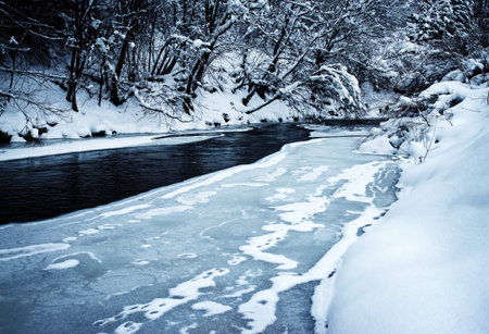 seasonal nature lanscape background winter river incomplete frozenの写真素材