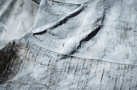 background or texture detail on gray old rubberized canvasの写真素材