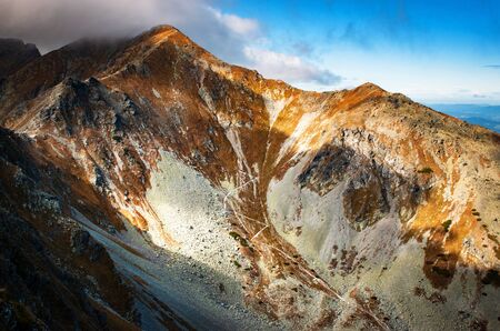 seasonal landscape background winding rocky footpath into the valleyの写真素材