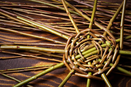 background detail of starting to knit wicker basket
