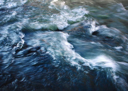 nature background Abstract blurred surface of fast river