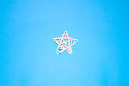 The layout of the new year, Christmas - a star lies on a blue background.の写真素材