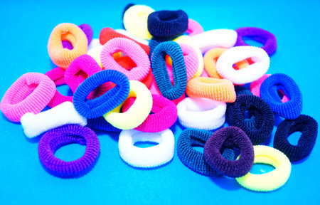 Hair bands are multicolored.Close-up. The concept of a comfortable hairstyle.