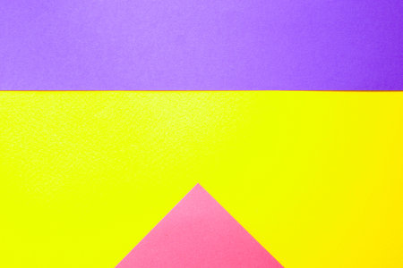 Graphic background of different geometric shapes in three colors: pink, yellow, purple.