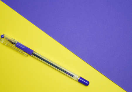 Purple pen on a yellow background. Background of two colors: purple, yellow.の写真素材