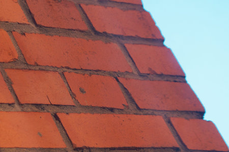 Old brick wall against the sky