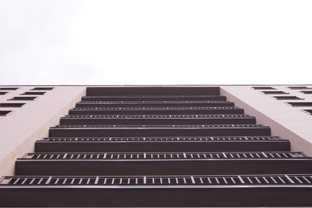 Tall building with open loggias on a white background.の写真素材