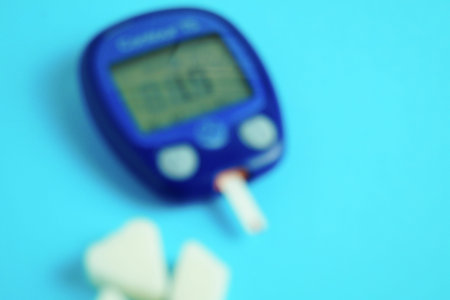 Glucometer with a very low sugar reading. Blur effect. Clouding of consciousness. Turbidity in the eyes. The concept of diabetes.の写真素材
