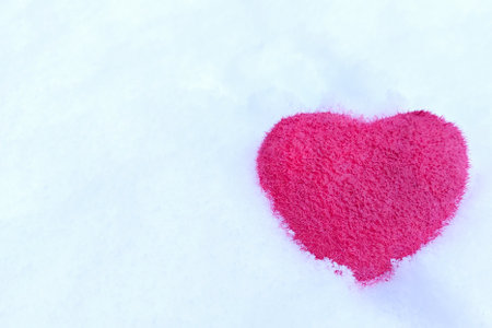 Valentines Day background. Red shaggy heart on fluffy snowy background.の写真素材