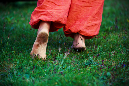 dirty foot man on green background.の写真素材
