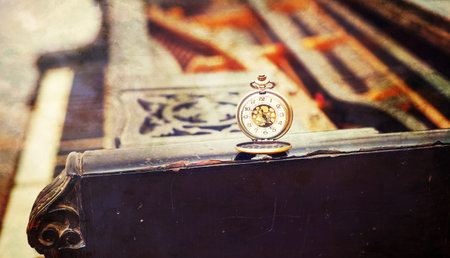 Vintage piano keys with antique pocket watch â time concept. vintage picture.の写真素材