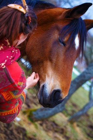 portrait woman and horse in outdoor. woman hugging a horseの写真素材