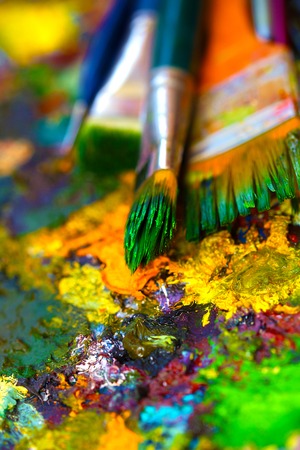 Paint brushes to the painting palette with colors.の写真素材