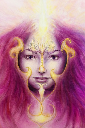 Mystic woman face with gold ornamental tattoo and two phoenix birds, purple background. eye contactの写真素材