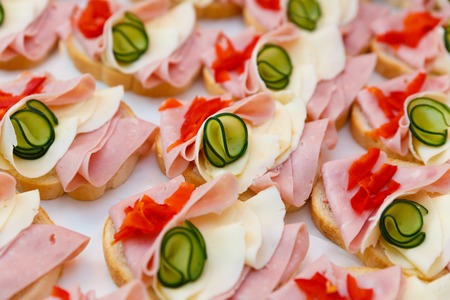 Beautifully decorated,  food snacks and appetizers with sandwich,  on party  or wedding celebration .の写真素材