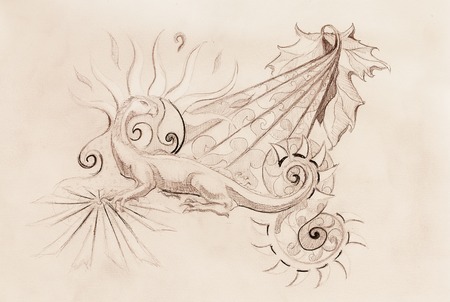 drawing of ornamental dragon and sun with wine leaf on old paper backgroundの写真素材