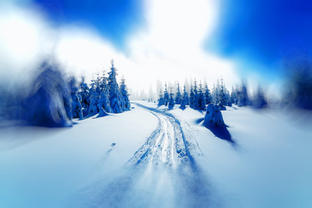 Beautiful mountain snowy landscape and traces of skiersの写真素材