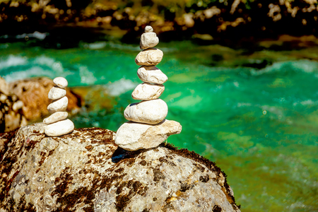 beautiful wild river with turquoise water and stone piles.の写真素材