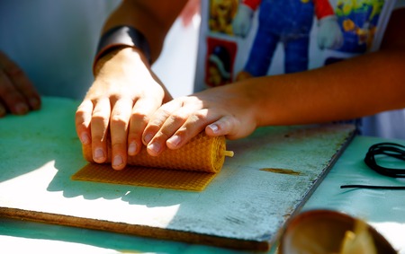 making candle from honey bee wax plate at marketの写真素材
