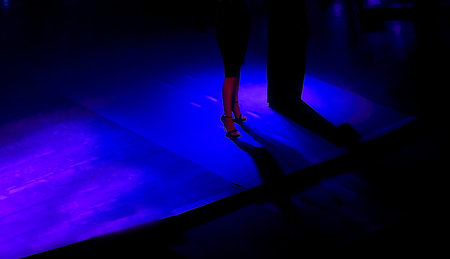 detail od female legs wearing elegant high heel shoes standing on stageの写真素材