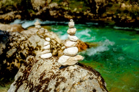beautiful wild river with turquoise water and stone piles.の写真素材