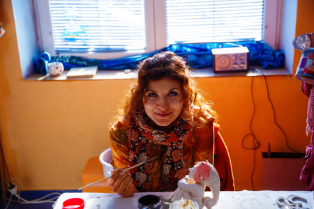 yong Woman making a dwarf figure. Creative concept.の写真素材