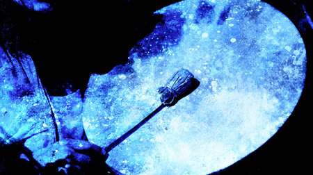 shamanic girl with frame drum on abstract structured background.の写真素材