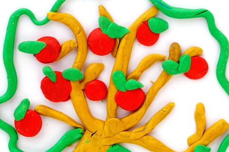 apple tree made with plasticine on white paper.の写真素材