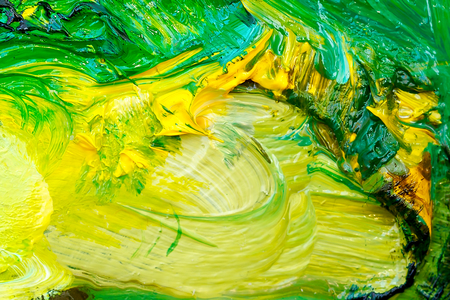 Detail of artist palette, color tones mixed together.の写真素材