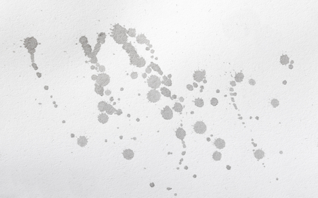 abstract black splashes on white watercolor paper. monochrome image.の写真素材