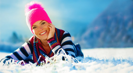 Beautiful woman and winter landscape. Front portrait. Copy space.の写真素材
