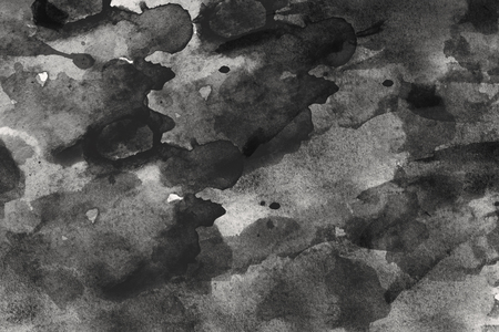 abstract black splashes on watercolor paper. monochrome imageの写真素材