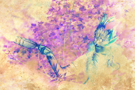 girl with shamanic feather mask in woodland surroundings. Graphic collage.の写真素材