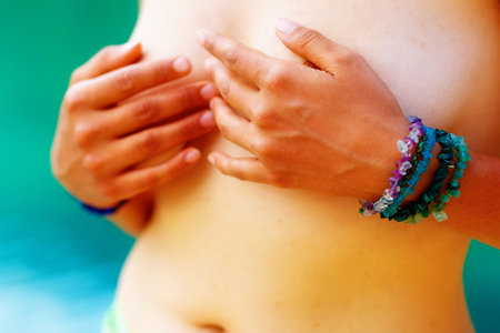 Detail beautiful naked woman on blurred water background.の写真素材