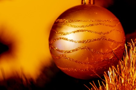 Close Up of Christmas-tree decorations. Golden color and blur background.の写真素材