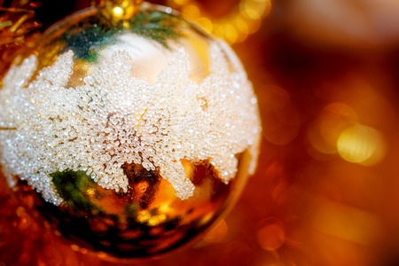 Close Up of Christmas-tree decorations. Golden color and blur background.の写真素材