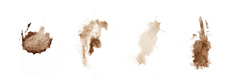 brown coffee splashes on white watercolor paper.の写真素材