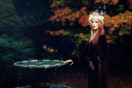 beautiful shamanic woman with headband in the nature.の写真素材