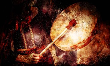 shamanic girl with frame drum on abstract structured space background.の写真素材