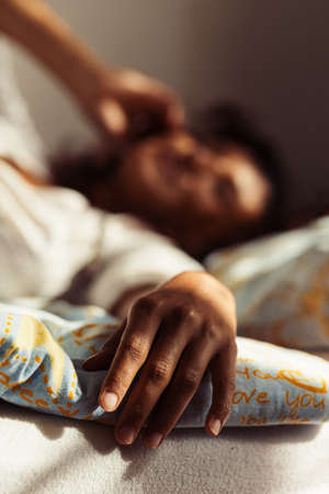woman in bed with phone.の写真素材