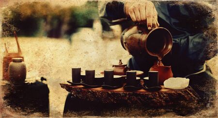 Tea ritual. Old photos effect with border.の写真素材