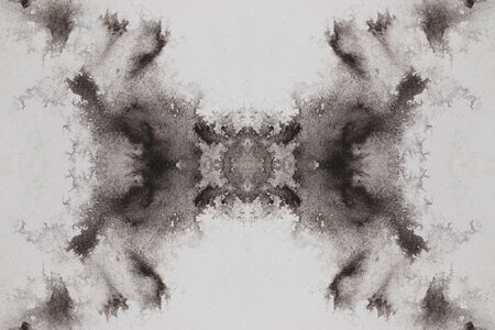 abstract black splashes on white watercolor paper. monochrome image.の写真素材