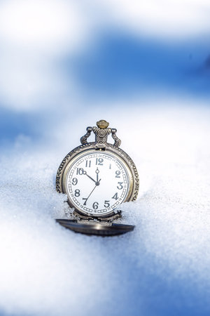 Historic watch on winter backgroun