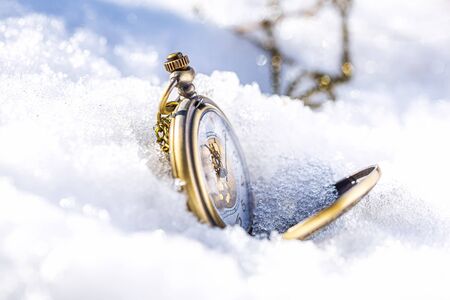 Clock showing five minutes to twelve. Time to stop and realize the values of lifeの写真素材