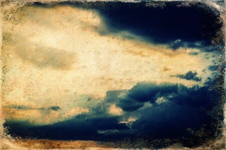 Sunset clouds with blue sky, sky cloud background, old photo effect.の写真素材