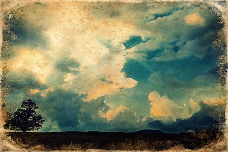Sunset clouds with blue sky, sky cloud background, old photo effect.の写真素材